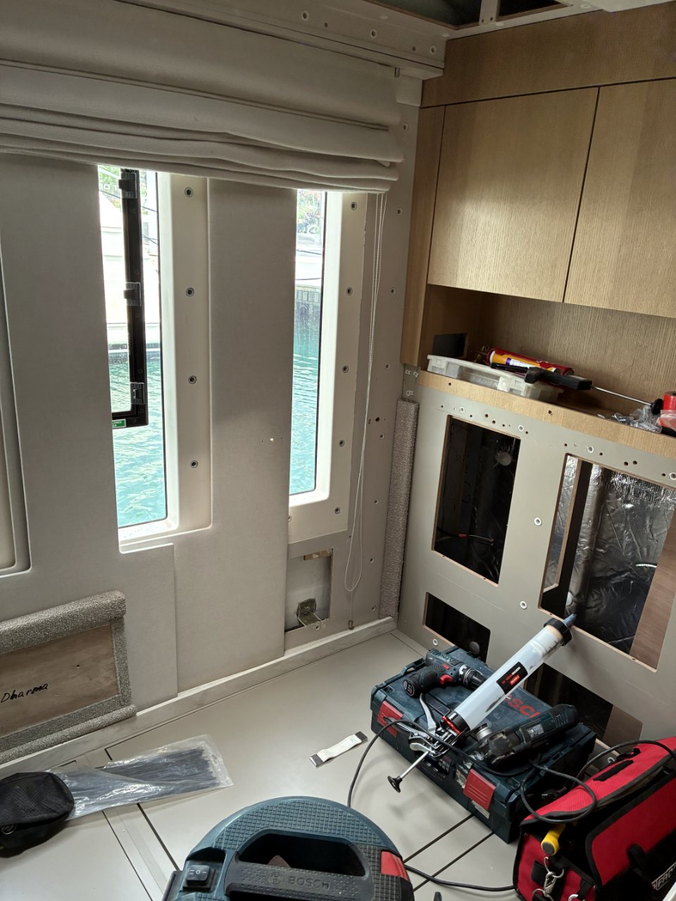 Hull side framed, openings cut for storage